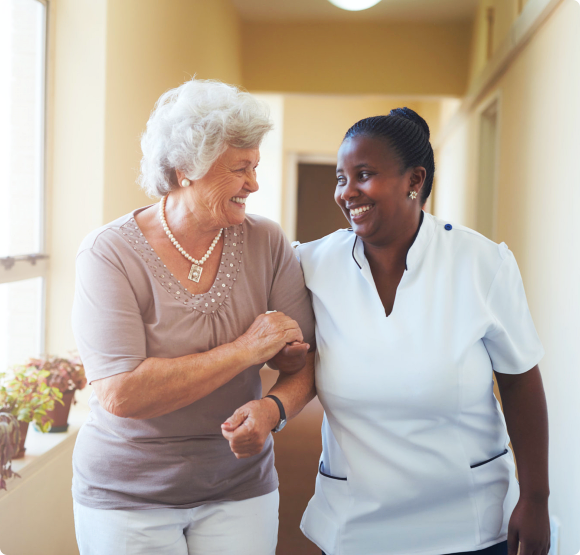 Portrait of smiling home caregiver and senior women